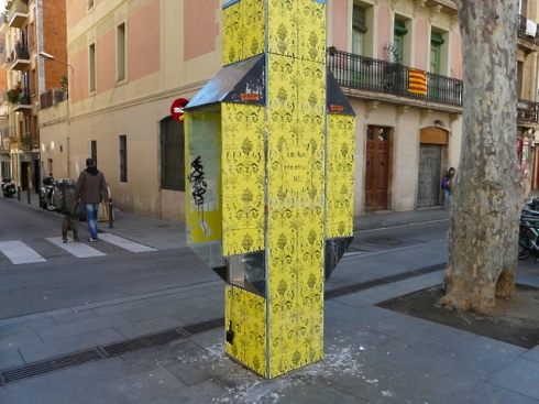 Places in Barcelona covered in yellow wallpaper street art