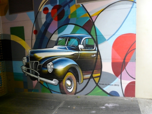 Street artists Kram & Owen paint building entrance in Barcelona